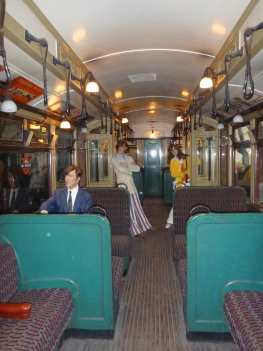 A real-scale diorama of how passengers might have looked on an old Tube car at the London Transport Museum.