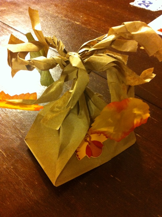 If you don't have a group to gather in gratitude this season, your kids can make their own individual family trees. Take a paper bag, cut 1" strips down about halfway from the opening while the bag is still closed, open the bag and twist the strips into branches. Then glue either pre-crafted leaves or cut out your own leaves and affix as many to the branches as there are members of the family. Another shout-out of thanks to our school's PTA for this wonderful art project they gave to all the kids during our "Lunch Art Bunch (LAB)" earlier this month.